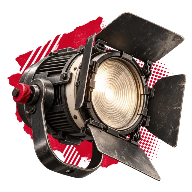 Industrieller Scheinwerfer aus dunklem Metall mit roter Collage